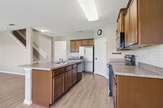 Building Photo - Spacious 5-Bedroom Home  – Prime Amelia Concourse Location!