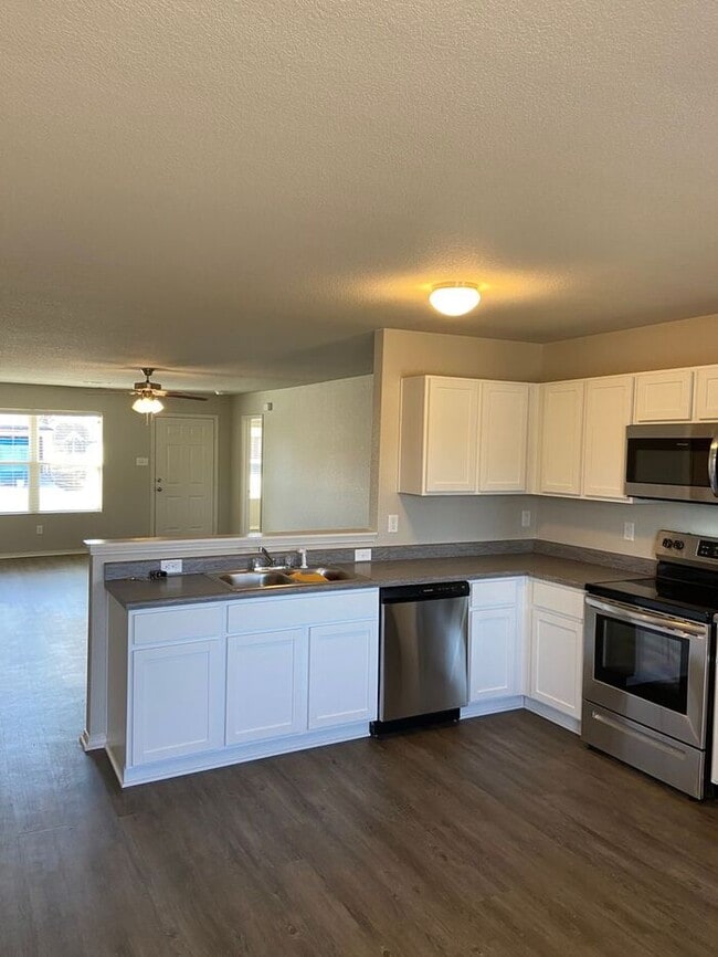 Building Photo - Pre-Leasing Now! | Modern Four-Bedroom, Two-Bath Home in Conrad Court