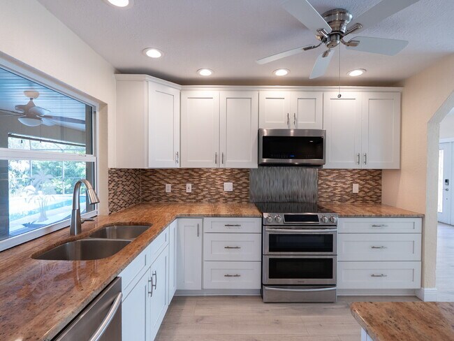 Building Photo - 3 BEDROOM • 2 BATHROOM • PRIVATE POOL • WATERFRONT • BOAT LIFT • ZERO DEPOSIT MOVE-IN AVAILABLE