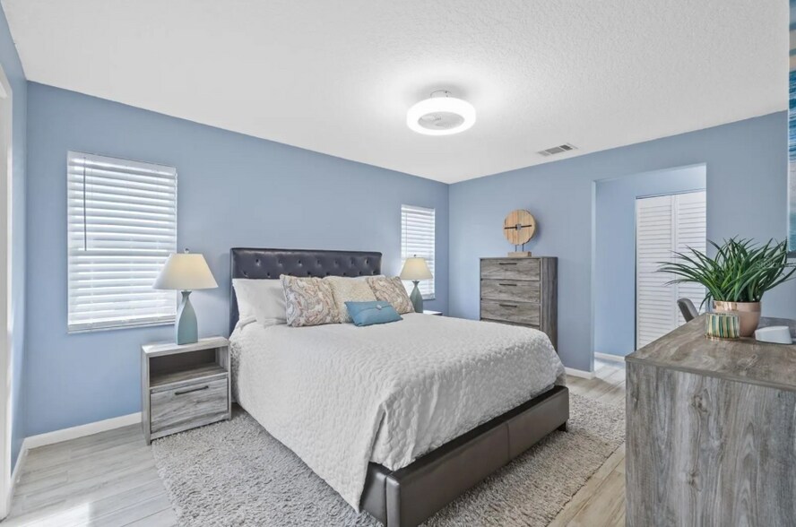 Relaxing primary bedroom retreat with soft natural tones. - 1932 Brainerd Ct