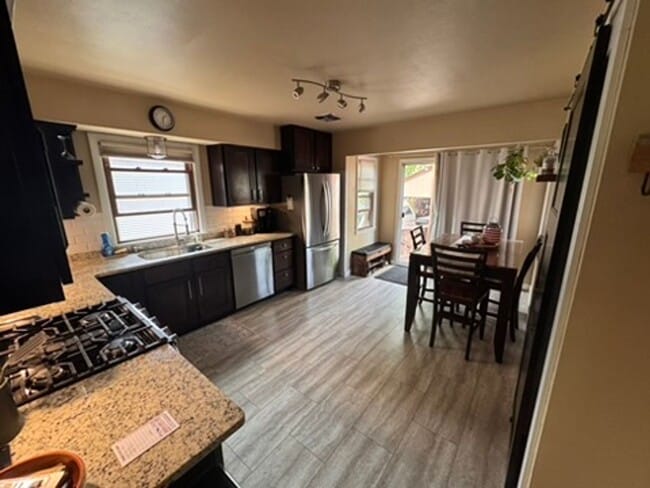 Building Photo - AVAILABLE SEPTEMBER 1: Updated 4-bedroom single family home on a quiet block- with 2 kitchens, 2 ...