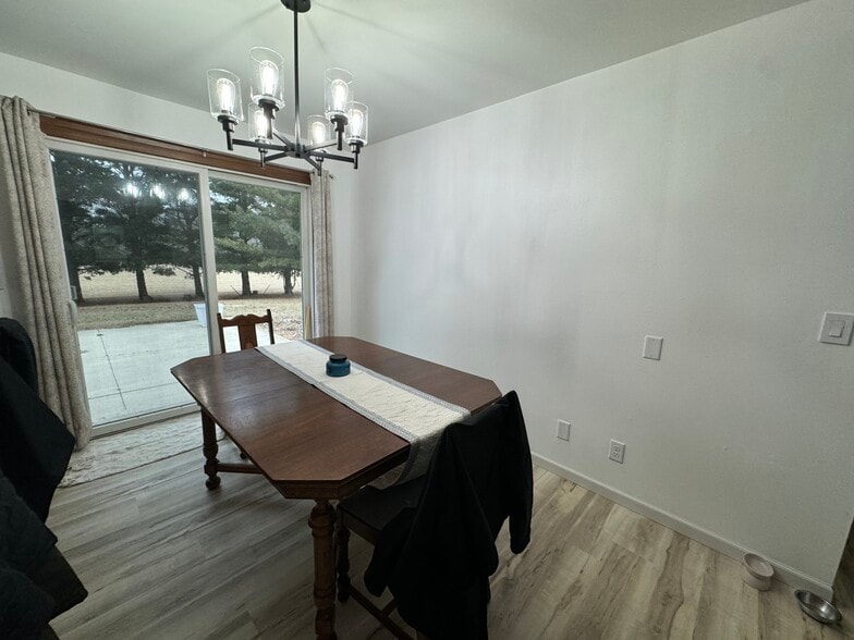 Dining room with patio door to back yard. - W2038 County Road WH