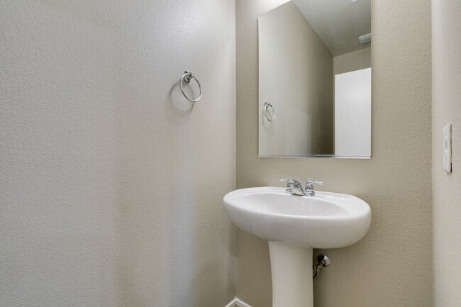Building Photo - Spacious Townhouse with Loft & Rare 3-Car Garage!