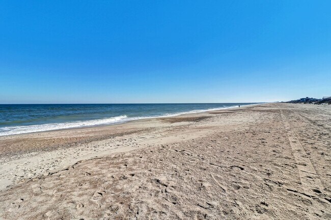 Building Photo - Live Steps from the Sand – Furnished Beach...