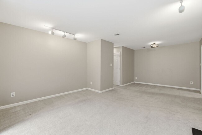 Building Photo - Contemporary design meets exceptional space in this inviting ground level residence, offering eff...