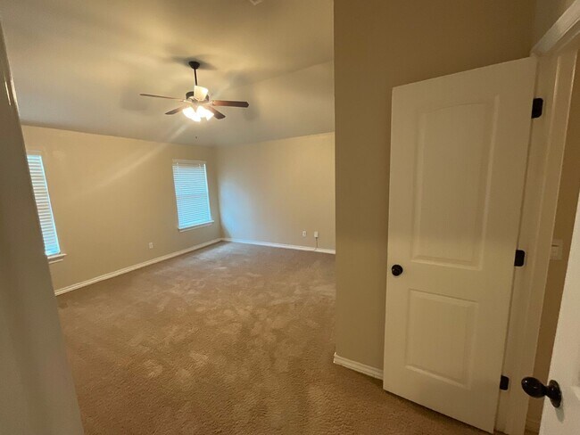 Building Photo - 4 bed, 2 bath, 2 car garage, 12-14 person Storm Shelter