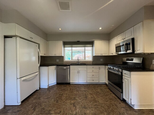 Building Photo - Beautiful 3-Bedroom Home with Remodeled Kitchen, Dual Living Spaces & Spacious Backyard