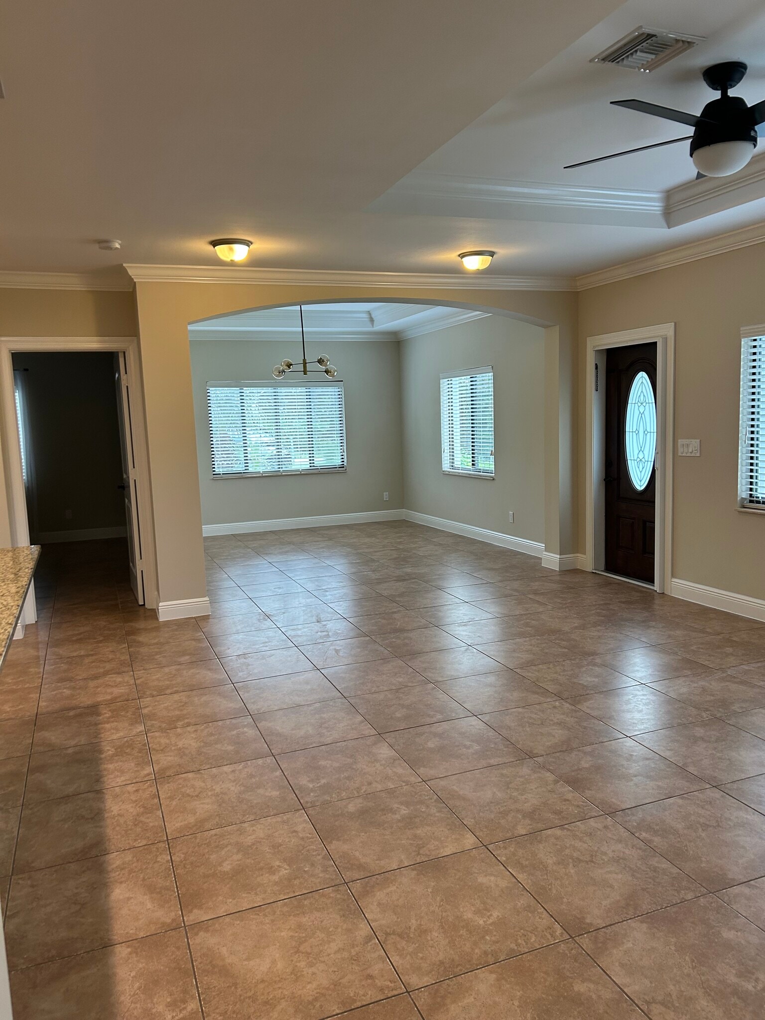 Living room looking into dining room - 4412 Vanda Dr