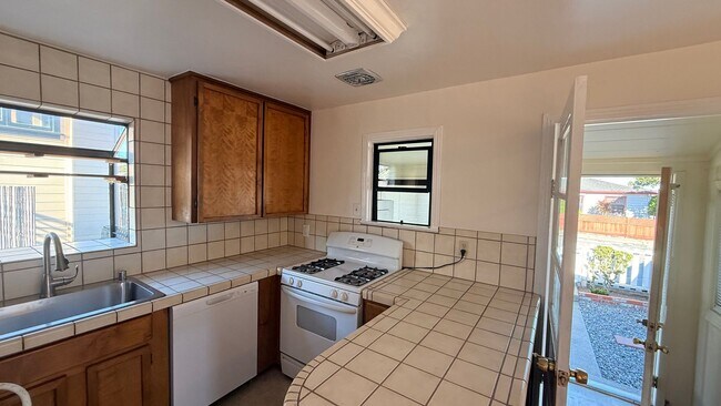 Building Photo - This two-bedroom, one-bath home in Upper Seaside - Close to NPS and DLI!