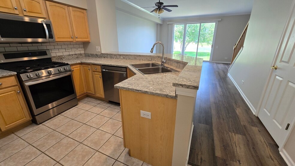Kitchen and open living area - 2807 Stonewater Dr