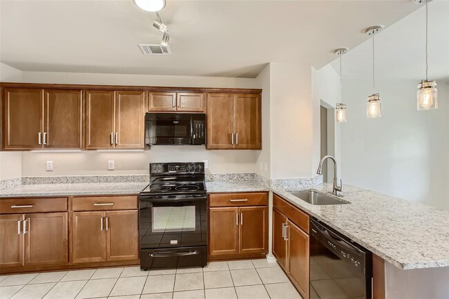 Building Photo - This well-maintained 4 bedroom home is located in a quiet neighborhood that has a community park ...