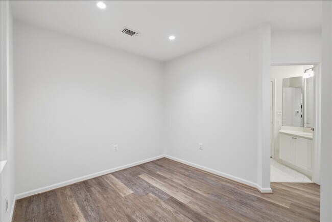 Building Photo - Commuter’s Paradise! Ground-Level 2BR Condo  Welcome home to this stunning, sun-filled 2-bedroom ...