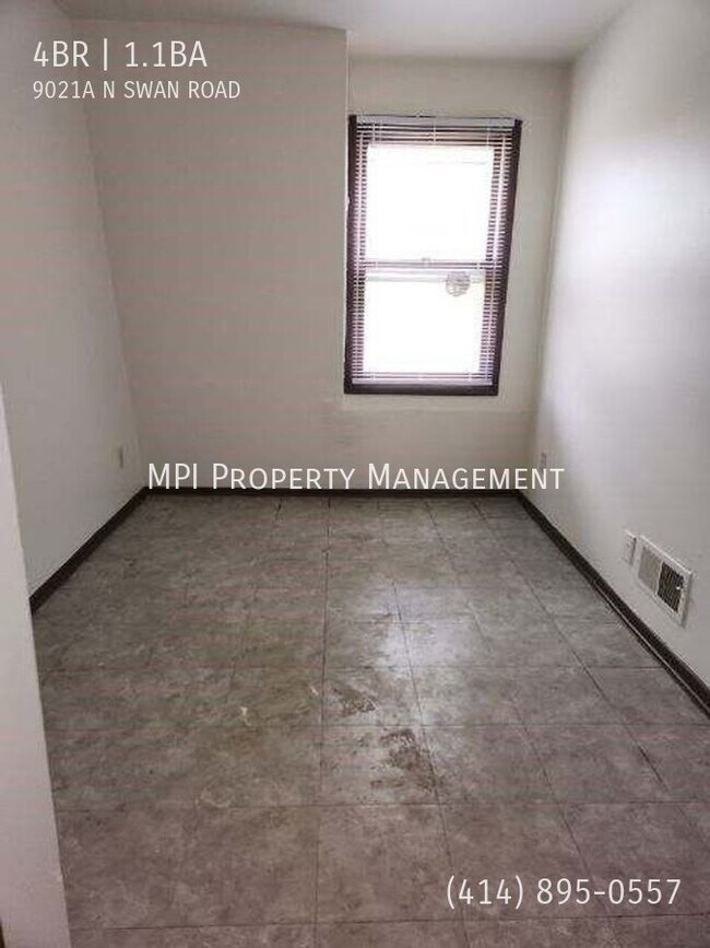 Building Photo - 9021 N Swan Rd