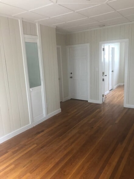 Living room to bedroom with 1/2 bath - 89 Congress St