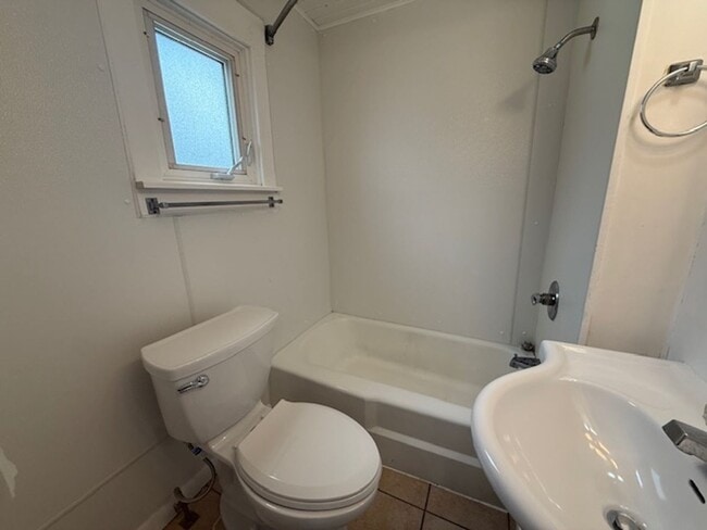 Building Photo - Classic Hardwood Floors, Fenced Yard & 2-Car Garage