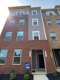 Building Photo - Immaculate & Stunning 3 Bedroom 2.5 Bathroom Brick, End-Unit Condo Style Townhome In Luxurious An...