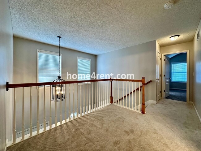 Building Photo - Beautiful Four-Bedroom Home with Three Car Garage, Wood Floors, Finished Basement and a Fenced Ya...