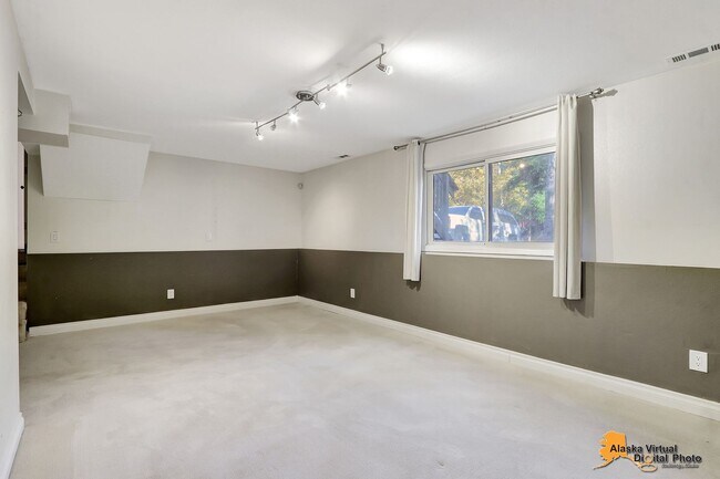 Building Photo - Eagle River Home w/ Fenced Yard, Sunroom, and Garage!