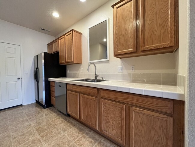 Building Photo - Inviting Two-Story 3BR Home Featuring New Carpet, New Stainless Appliances, Spacious Garage Stora...