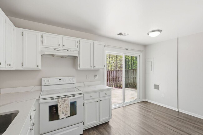 Building Photo - This beautifully refreshed condominium offers a refined blend of style and comfort