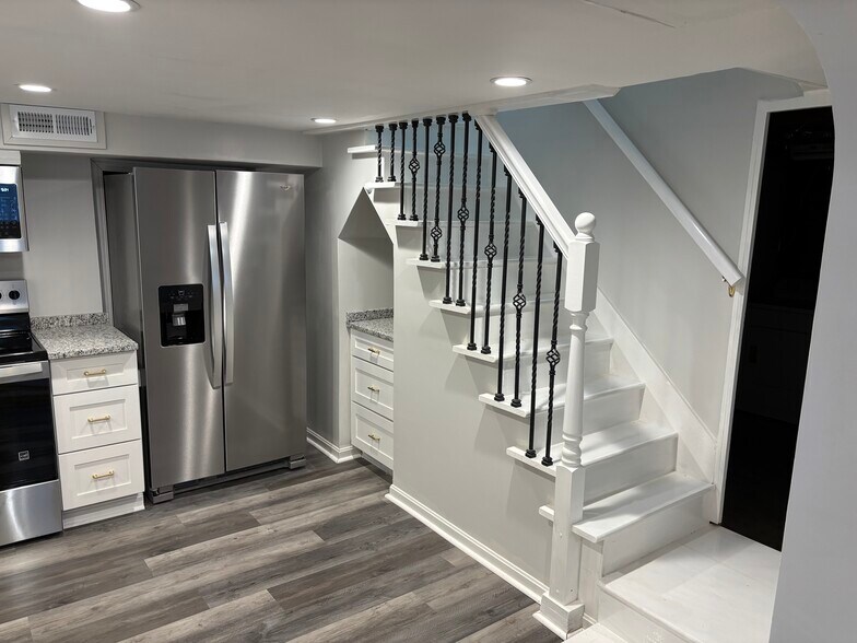 Kitchen and Stairs up - 210 Boston Dr