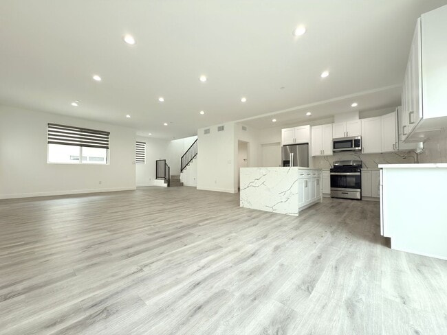 Building Photo - Chic Modern Living in Panorama City – 4 Be...