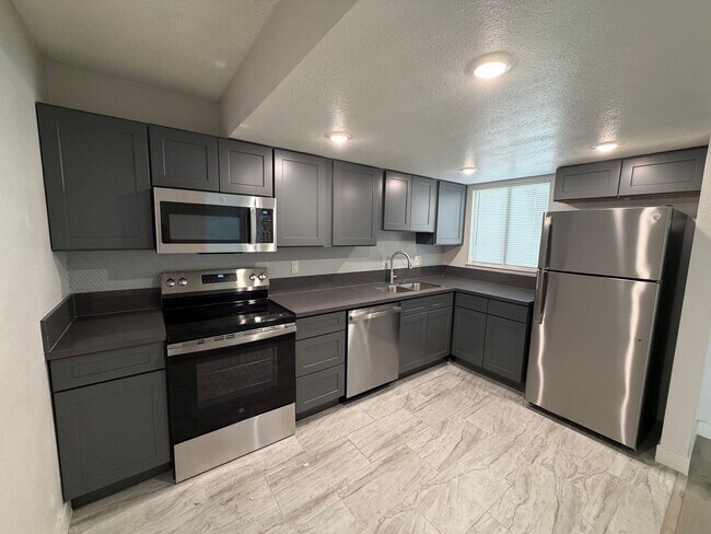 Building Photo - BEAUTIFULLY RENOVATED 3/2/2 CAR WITH DEN