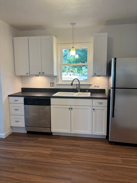 Newly refreshed kitchen with stainless steel appliances and white shaker style cabinetry - 1725 S 35th St