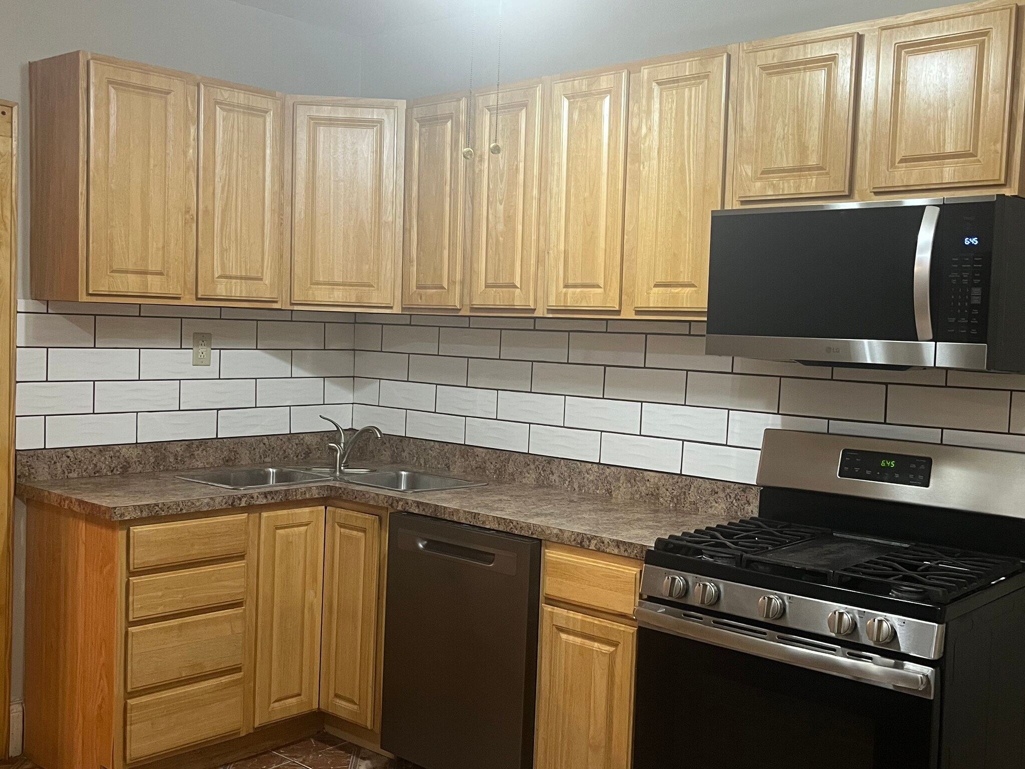 Kitchen with stainless steel gas range - 7619 S Phillips Ave