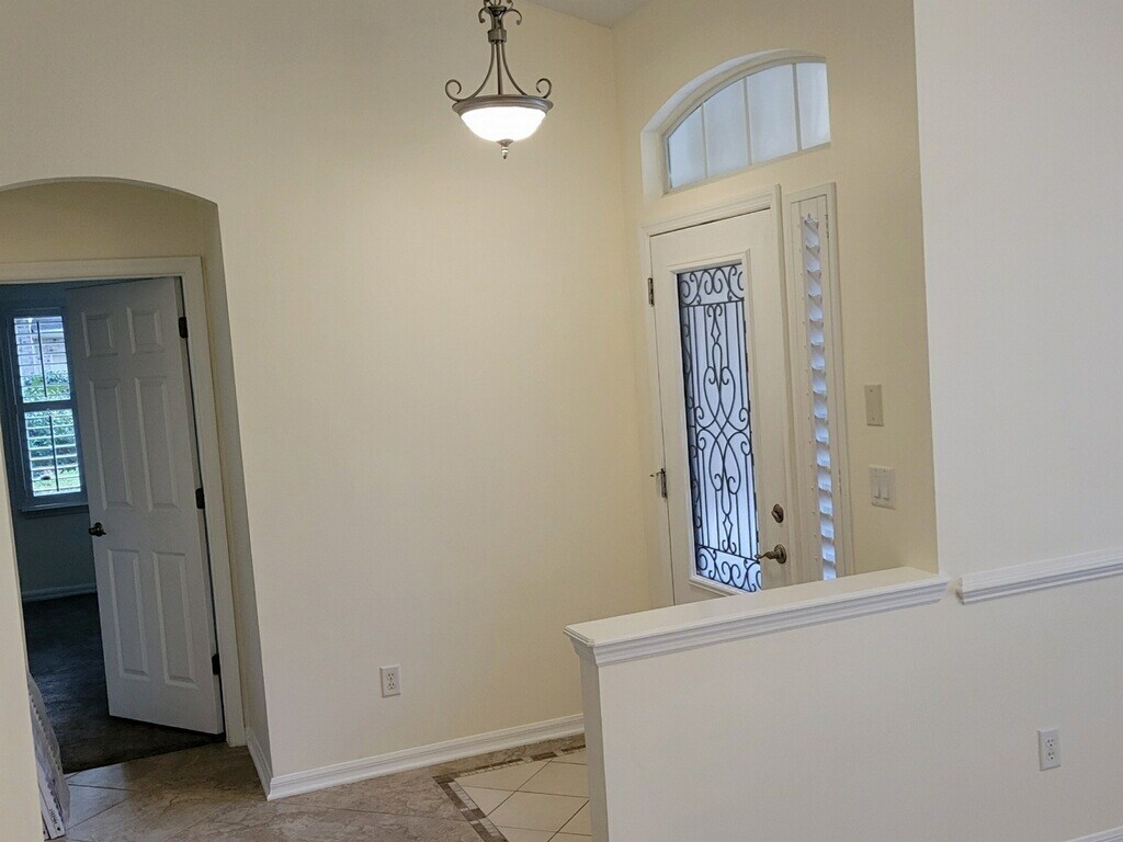 Dining area with master bedroom entrance - 4538 Palmetto Cove Ln