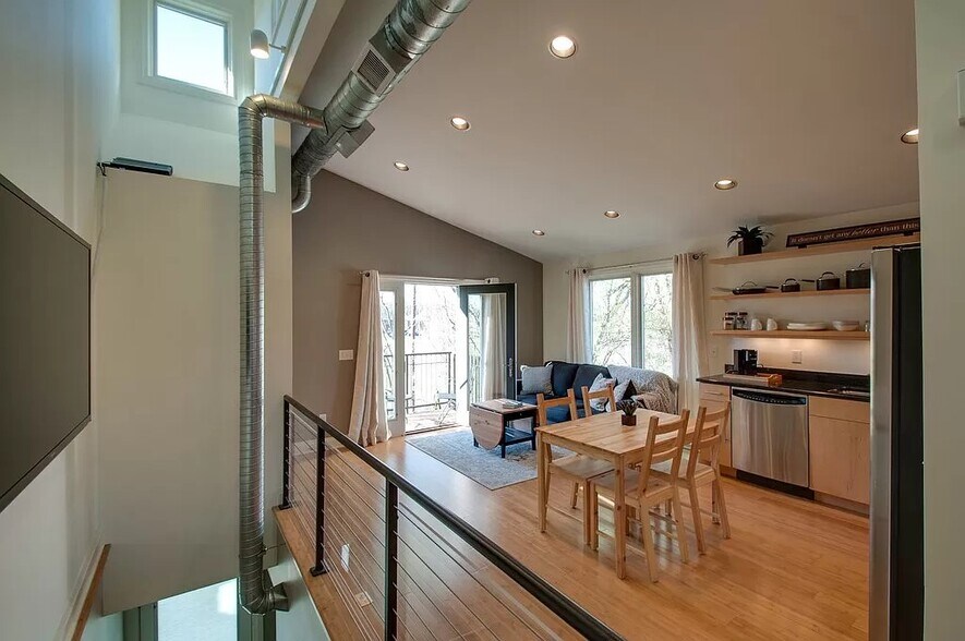 Bright and spacious living area. - 324 Van Buren St