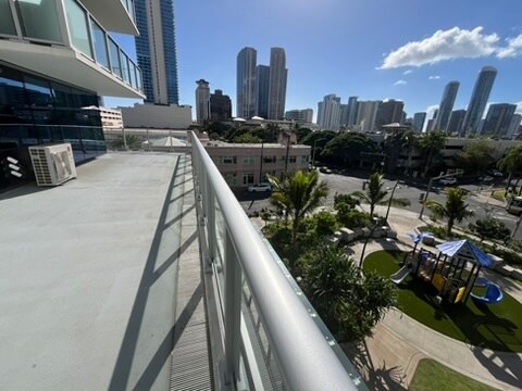 private lanai overlooking a public playground and park - 1500 Rycroft St