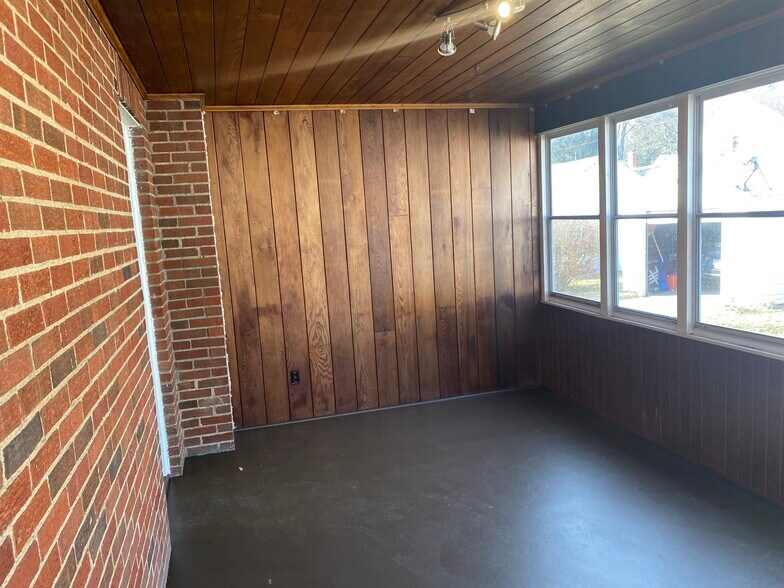 Brick and wood paneling - 2529 Broad Blvd