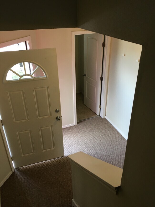 Front door entry, half bath on the right - 4711 S Puget Sound Ave