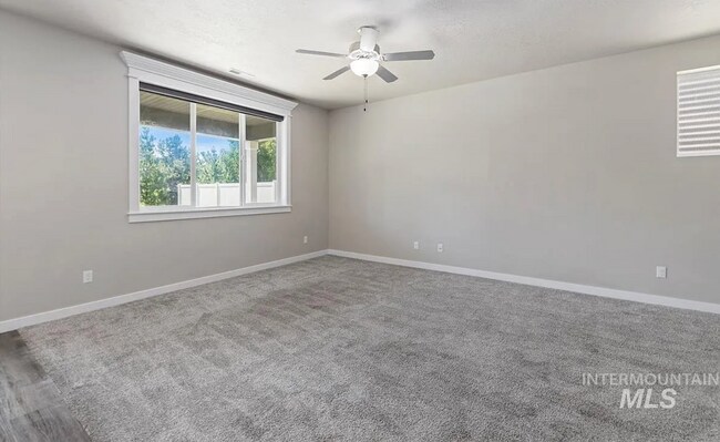 Building Photo - Stunning 4-Bedroom Home with Privacy & Low-Maintenance Living in Verado