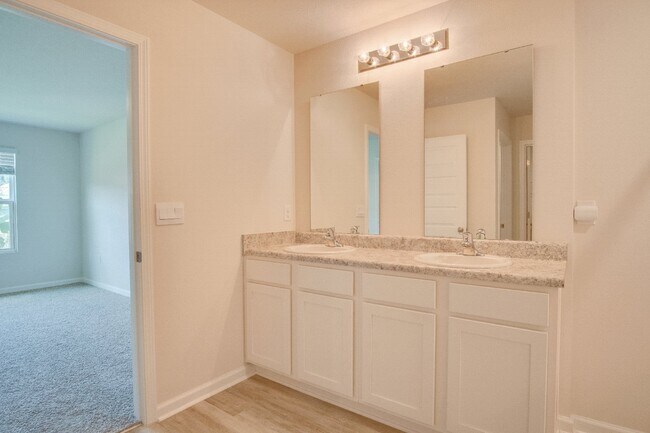 Building Photo - 4-Bed, 2-Bath Home in Woodlands Subdivision with Solar, Open-Concept Living, Modern Kitchen, Fenc...