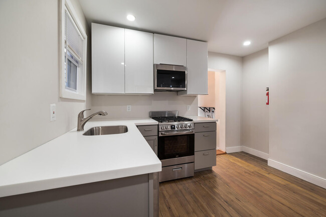 High gloss white cabinets - 150 John Street