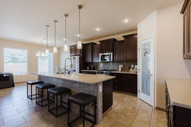 Building Photo - Meticulously kept 4 bedroom home with RV Parking/Hook ups