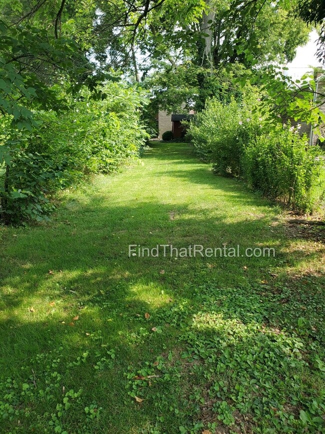 Building Photo - Charming Historic Retreat with Private Fenced Yard & Parking – Prime Downtown Location