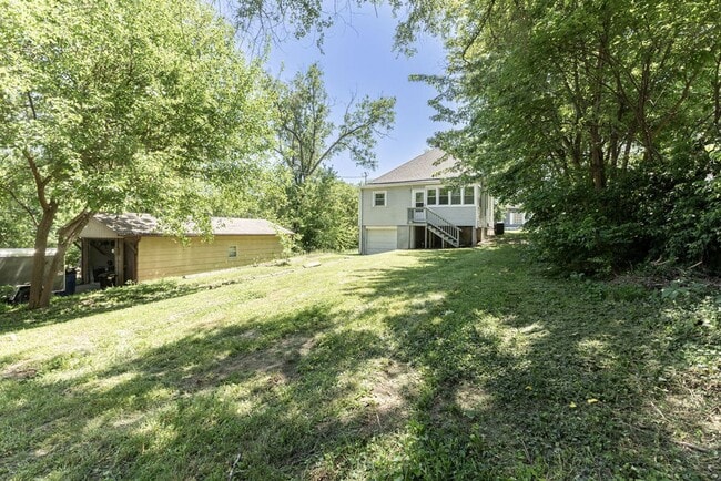 Building Photo - Remodeled 2-Bedroom Bungalow with Spacious Yard & 1-Car Basement Garage