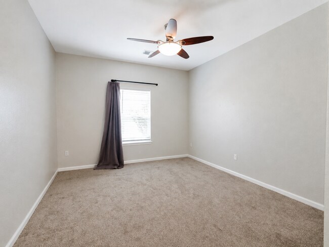 Building Photo - Spacious 2-Bedroom Condo with Garage, Fireplace, Pool & Most Included Utilities