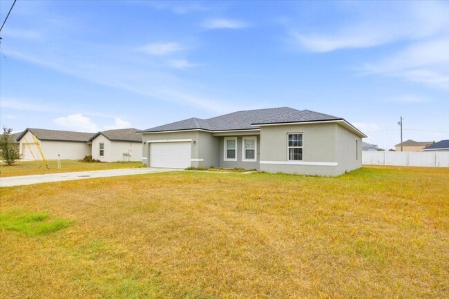 Building Photo - Stunning 4-Bedroom, 2-Bath Home in Poinciana with Modern Upgrades