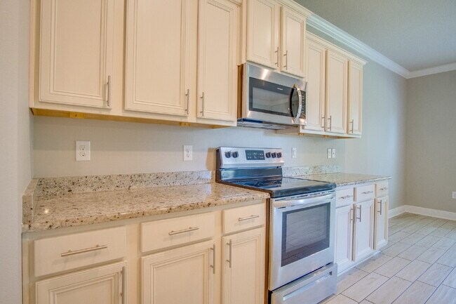 Building Photo - Spacious 4BR Pool Home with Modern Upgrade...