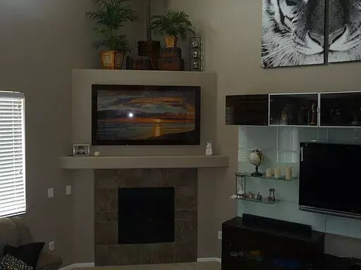 Family room fireplace - 15455 Carob Cir