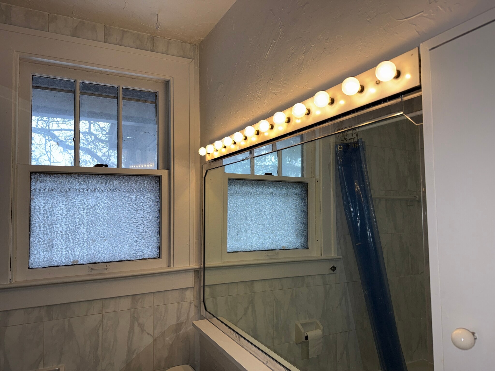 Large Make up mirror in bathroom - 40 W Tompkins St