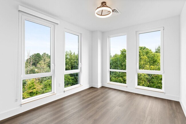 Building Photo - 2 Bedroom Corner-Unit with Wooded Balcony ...