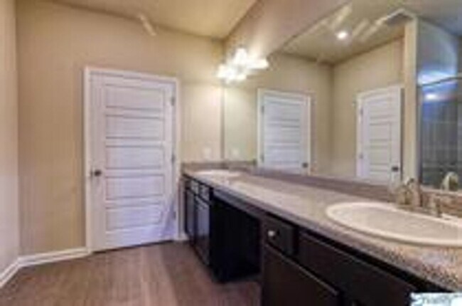 Building Photo - COMING SOON! Welcome to the Carlyle—where classic brick farmhouse charm meets a sleek, modern lif...