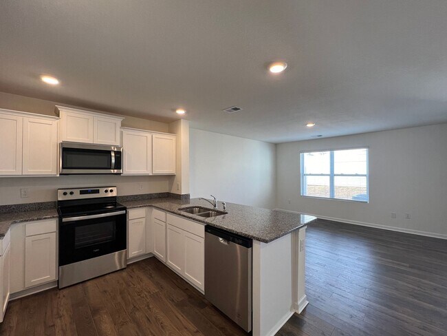 Building Photo - Beautiful New Construction 3 bedroom 2.5 Condo   with garage- Water, trash & sewer incuded!