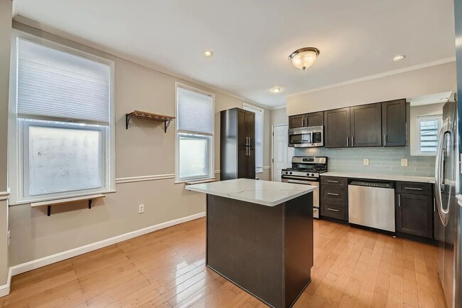 Building Photo - Charming 3 Bedroom/2.5 Bathroom Townhome in Patterson Park with Parking Pad!