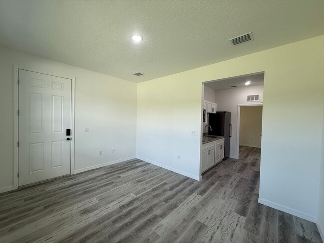 Building Photo - New Construction Suite! 1/1 Side entry uni...